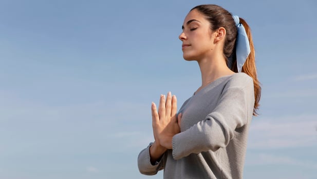 side-view-woman-meditating-nature